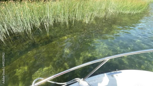 Crystal clear river Cetina view from moving boat in Croatia 