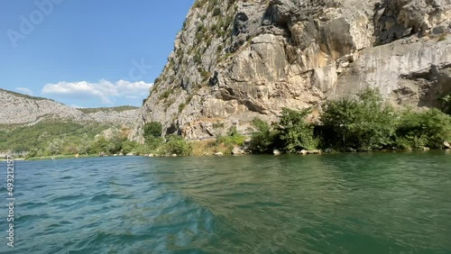 Crystal clear river Cetina in Croatia back view from boat