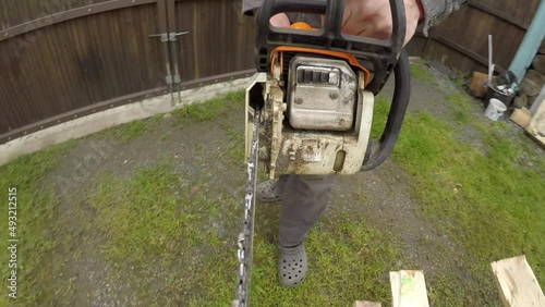 Cutting wood with a chainsaw. Chainsaw massacre in first person.