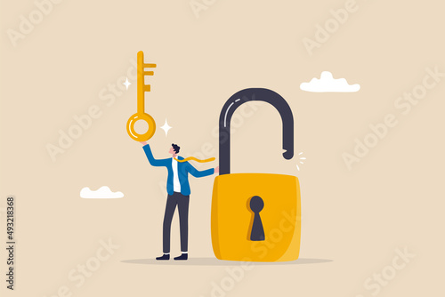 Golden key to unlock, solve business problem, professional to give solutions, success business key or unlock business accessibility concept, smart businessman holding golden key to unlock the pad.