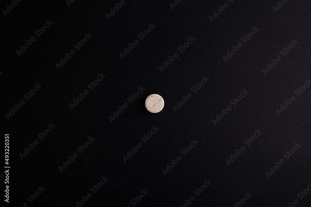 Pills, vitamins, medicine macro photo on background