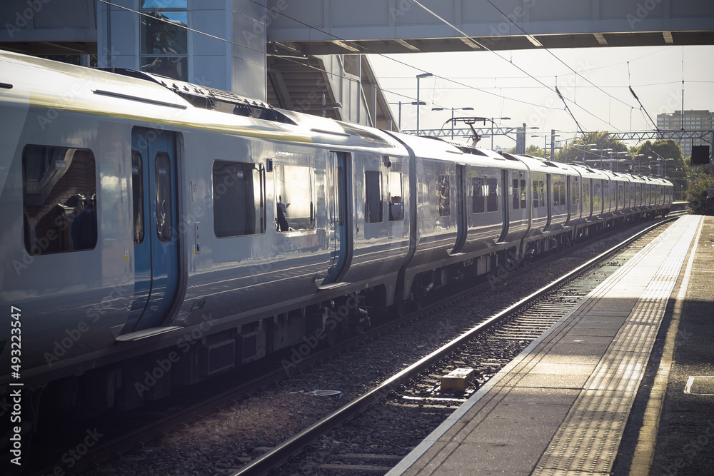 Trains waiting for departure at platform of the West Hampstead railway station in London