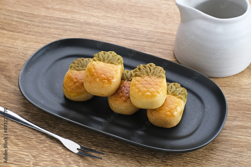 Nastar Cookies, Taiwanese Pineapple Cookies with pineapple-shaped filled with jam. Served on plate. Nastar Cookies, Taiwanese Pineapple Cookies with pineapple-shaped filled with jam. Served on plate.