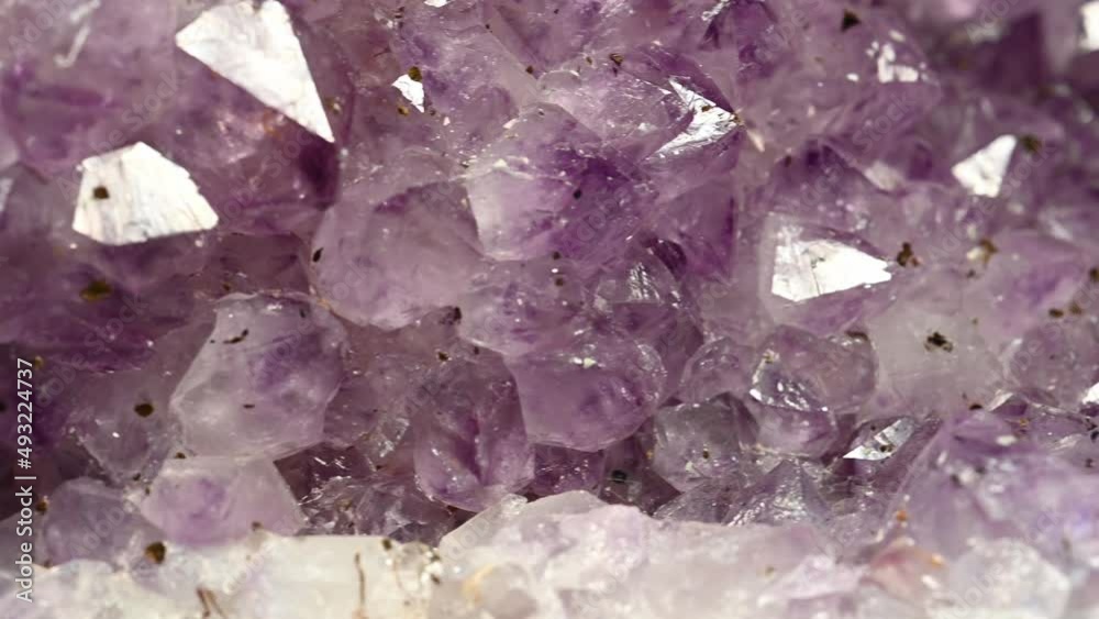 very close sliding view of a large deposit or amethyst, semi-precious gemstones very close sliding view of a large deposit or amethyst, semi-precious gemstones
