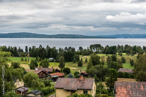 Segersta, Halsingland - Sweden -Panoramic view over old village houses with the Ljusnan river in the background
