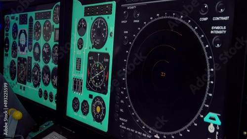 View of monitor displays in modern combat aircraft cockpit.