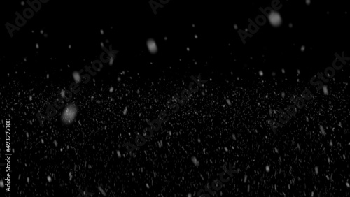 Falling snow at night. Bokeh lights on black background, flying snowflakes in the air. Overlay texture. Snowstorm. Falling snowflakes isolated on black background - Design element. 