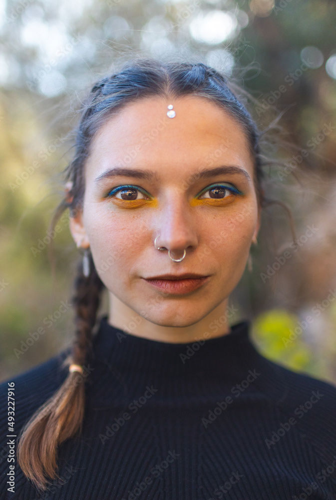 Portrait of a beautiful girl, a woman with a piercing in her nose Portrait of a beautiful girl, a woman with a piercing in her nose