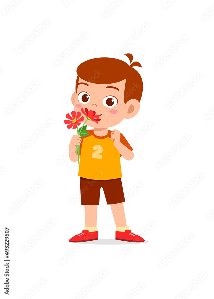 little boy holding flower and sniff the scent little boy holding flower and sniff the scent