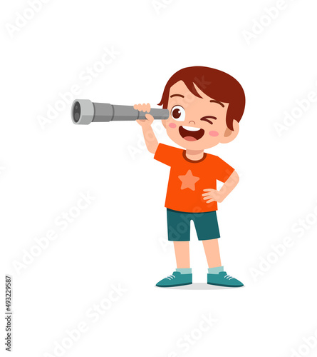little boy standing and see using telescope