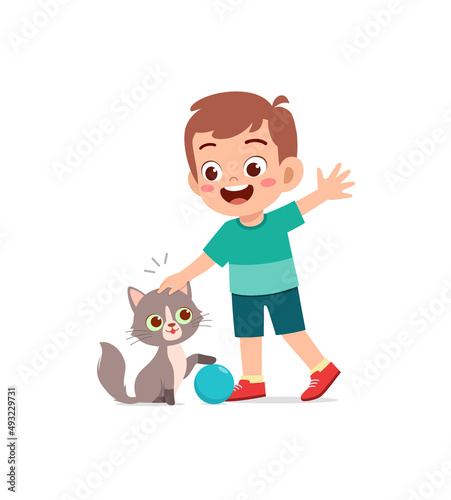 little boy playing together with cute cat
