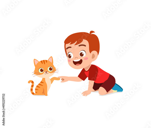 little boy playing together with cute cat