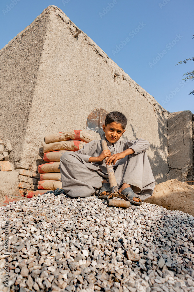 Fototapeta premium Poor children are forced to work construction 