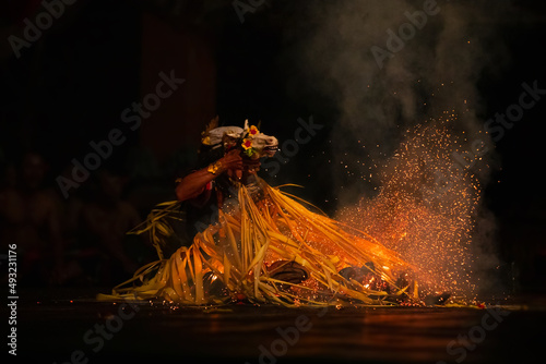 Man performing traditional Indonesian dance at Ubud Palace Bali theater at night - Bali, Indonesia