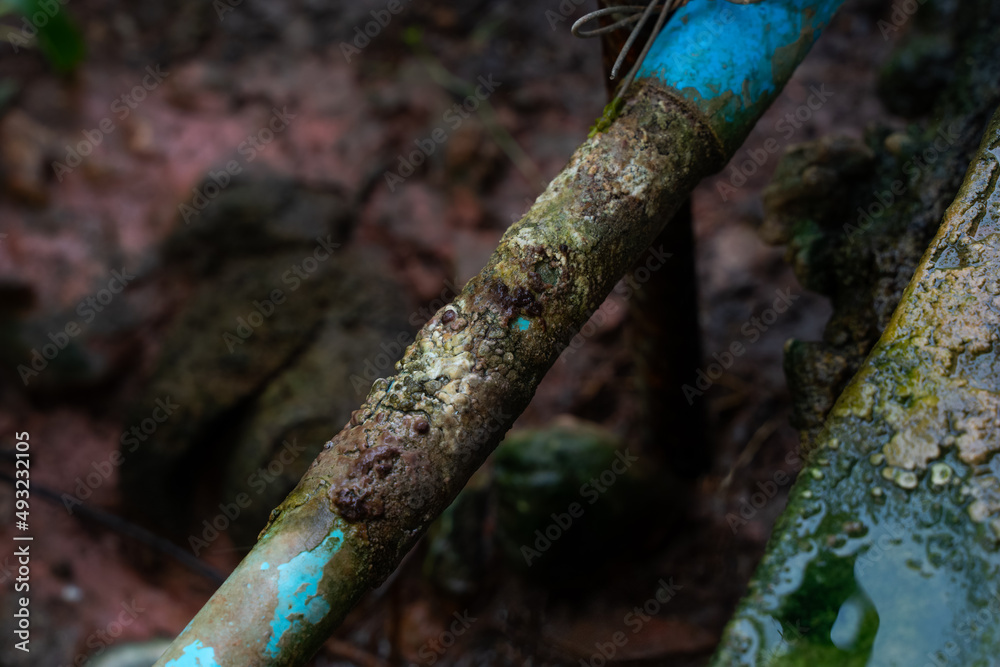 dirty PVC pipe on ground. grungy PVC pipe. aged weathered grunge rust pipeline . dirty PVC pipe on ground. grungy PVC pipe. aged weathered grunge rust pipeline .