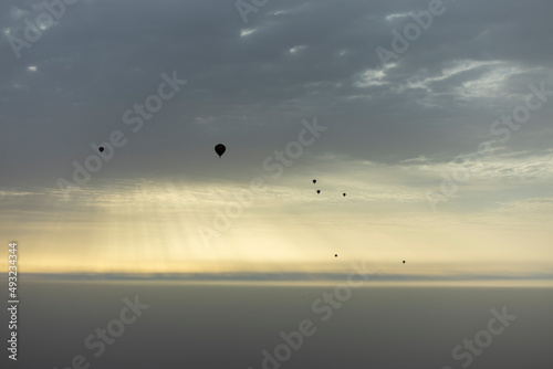 Sunrise balloons in flight over the north west Saudi Arabian desert area of Al Ula