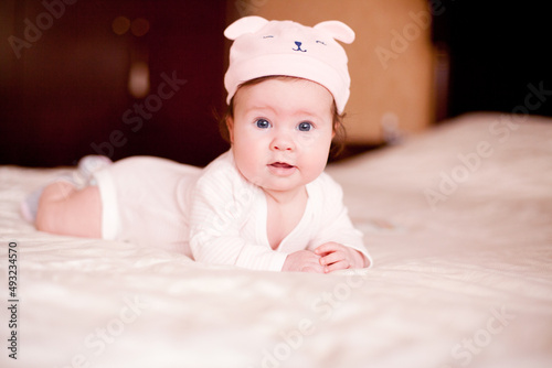  baby in a hat bearhat 
baby, child, newborn, childhood, kid, face, hat, infant, boy, adorable, eyes, small, pink, toddler, cute, little, beauty, funny, smile, person, happiness, sweet, innocence, ex photo