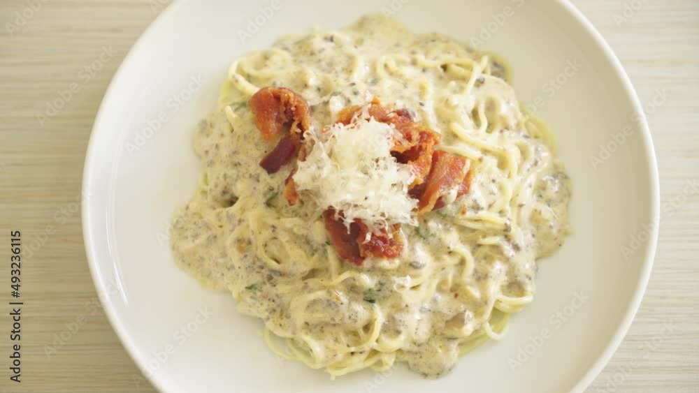 spaghetti with truffle cream sauce and mushroom on plate spaghetti with truffle cream sauce and mushroom on plate