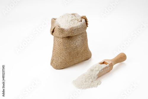 Flour in bowls and bags isolated on a white background. High quality photo