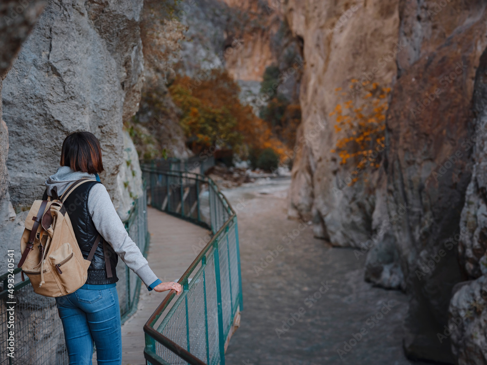 Happy asian woman is enjoy active hiking along the Saklikent Gorge in Turkey. New experience and outdoor leisure recreation Happy asian woman is enjoy active hiking along the Saklikent Gorge in Turkey. New experience and outdoor leisure recreation