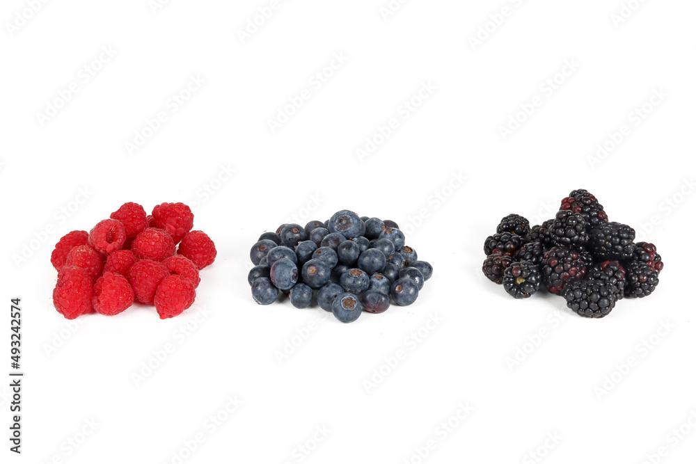 blueberries blackberries and raspberries isolated on white blueberries blackberries and raspberries isolated on white