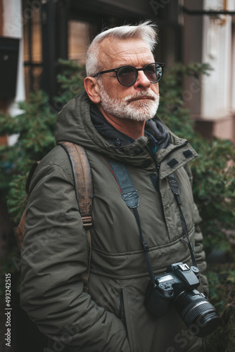 Portrait of an active pensioner. Mature male photographer. © Andrii Zastrozhnov