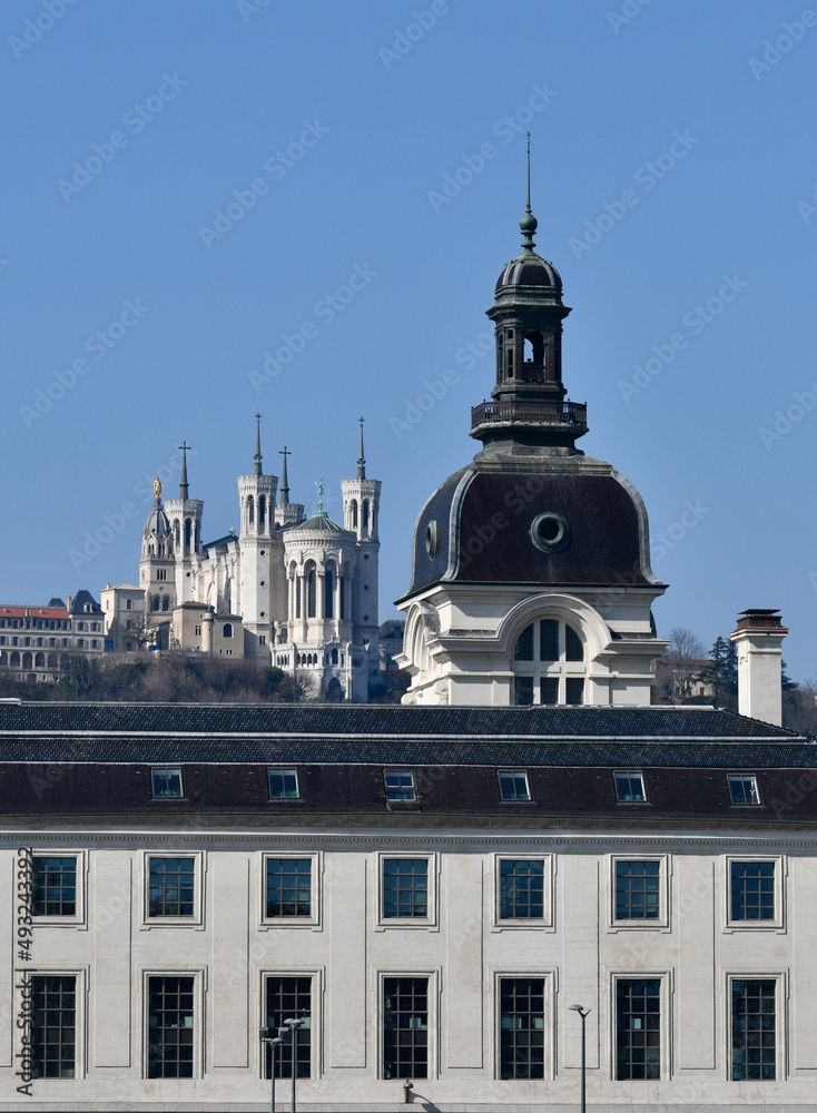 Basilica of Our Lady of Fourvière with in the foreground a tower of the Hotel Dieu de Lyon in France