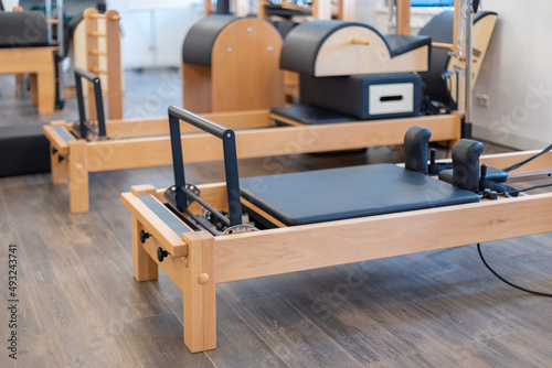 Fitness pilates stretch tables and other exercise equipment in gym. High quality photo photo