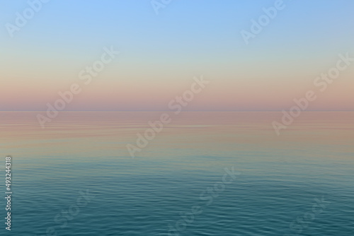 The calm surface of the sea in the evening at sunset during a complete calm as a background.