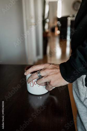 person grabbing coffee
