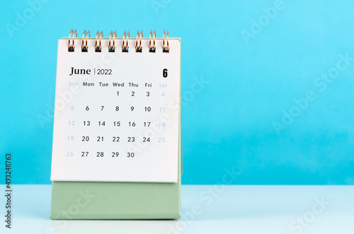 June calendar 2022 on blue background.