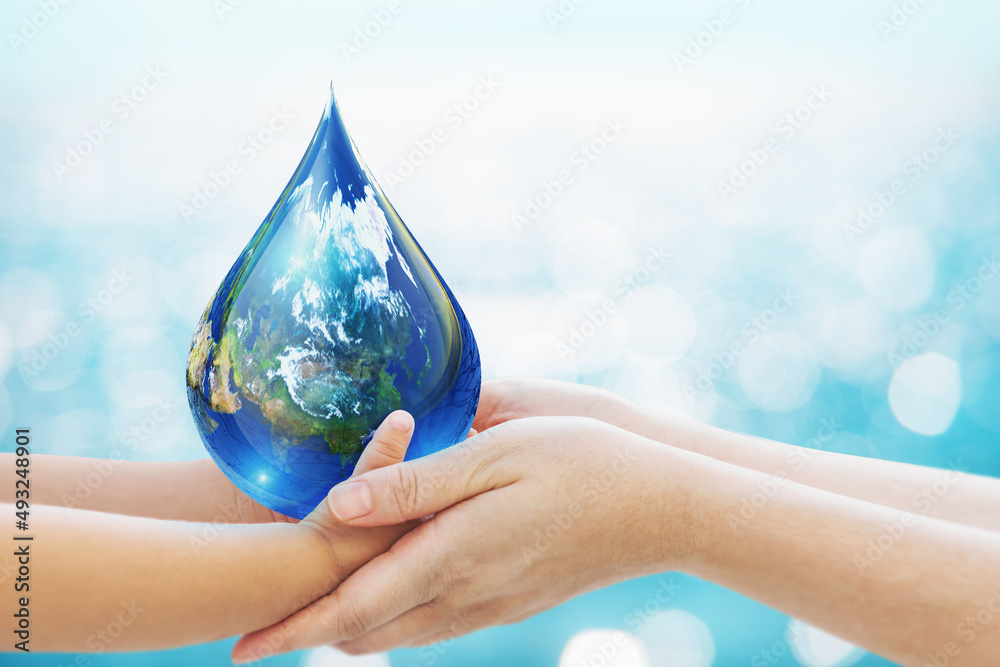 World water day concept . baby Hand and Mom hand Holding Earth in Water Drop shape on Blue Bokeh background.Copy Space on horizontal sheet.Clipping path.Elements of this image furnished by NASA - obrazy, fototapety, plakaty 