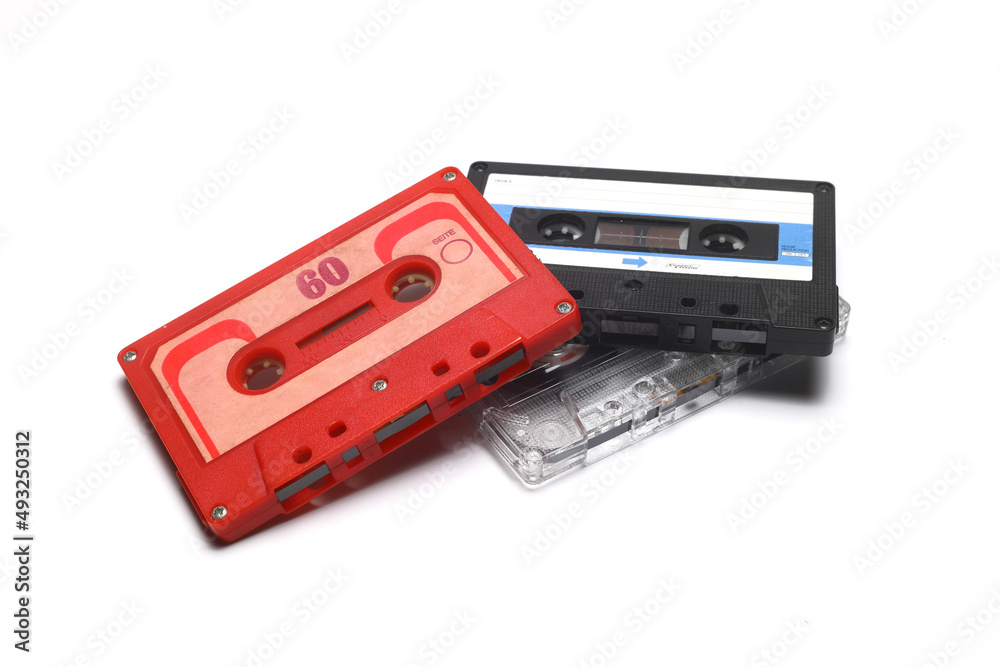 Retro audio cassette tape from the 80s and 90s on a white background.
Retro audio cassette tape from the 80s and 90s on a white background.