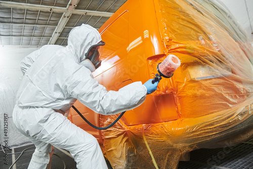 car painting in chamber. automobile repair service photo