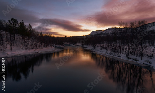  Dawn after the polar night on the banks of the Vaenga river. Kola peninsula. photo