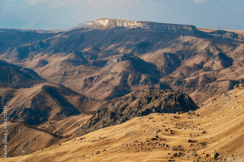 Mountain valley and creeping velvet shadows of Bermamyt plateau.