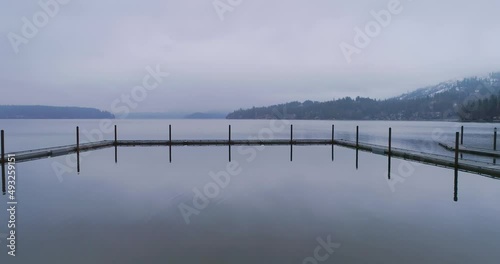 Winter aerial footage of Hayden Lake and lake homes with docks photo