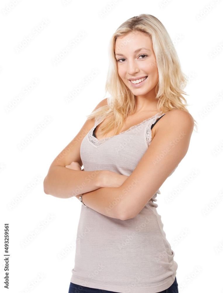 Shes full of confidence. A young blonde woman standing with her arms folded. Shes full of confidence. A young blonde woman standing with her arms folded.