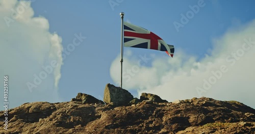 The flag of the United Kingdom flutters proudly in the wind.