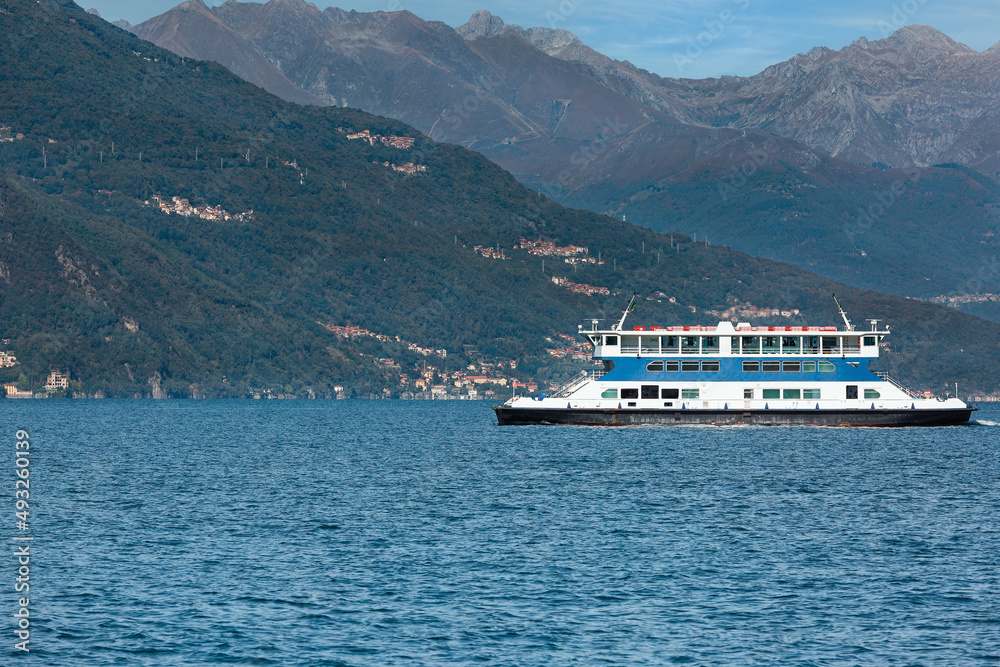 tourist ship on the background of mountains on Lake Como