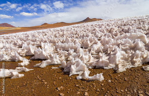 Landscape in the high Andes of Chile with snow penitentes: remnants of snow at 5000 meter altitude formed by the action of the wind in a very dry climate photo