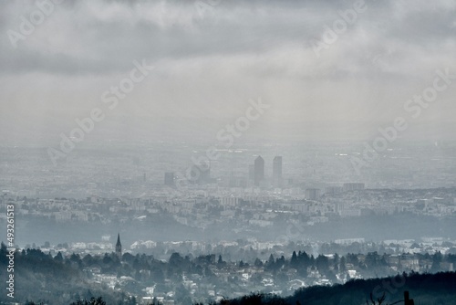Distant panorama of the city of Lyon in France on a bright and misty day