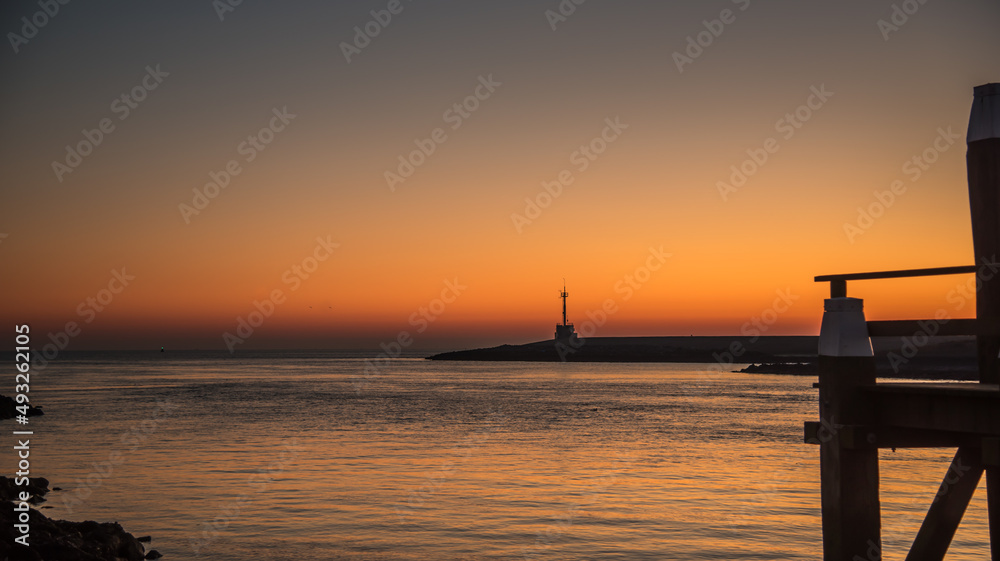 Den Helder, Netherlands. March 2022. The harbor head of Den Helder at sunrise. Den Helder, Netherlands. March 2022. The harbor head of Den Helder at sunrise.