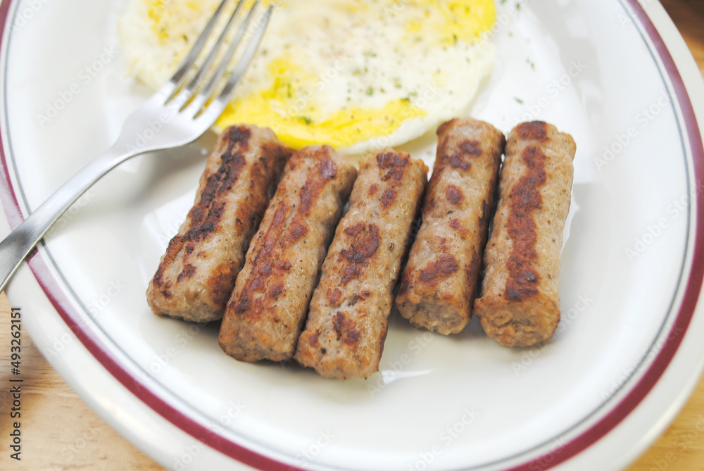 Close-Up of Sausage Link as Part of an Egg Breakfast
