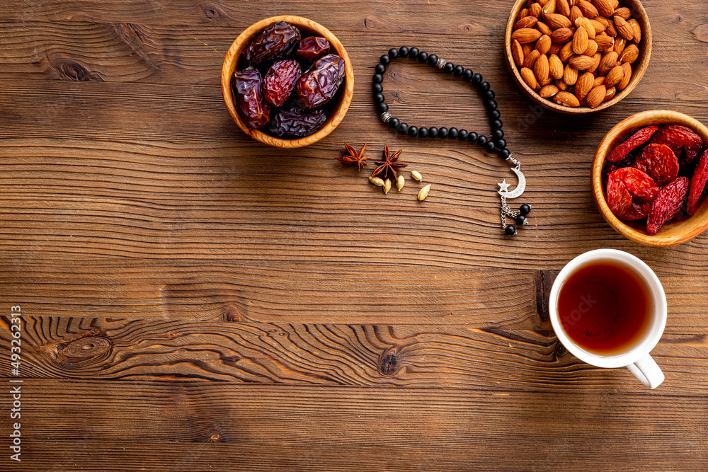 Islamic rosary with dates and tea. Ramadan Kareem concept. Islamic rosary with dates and tea. Ramadan Kareem concept.