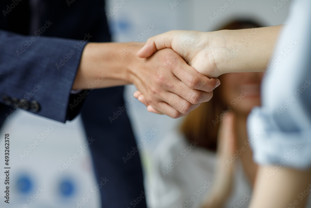 Business making handshake with his partner in office, business etiquette, congratulation, merger, and acquisition Gesturing People handshake Connection Deal Concept Business making handshake with his partner in office, business etiquette, congratulation, merger, and acquisition Gesturing People handshake Connection Deal Concept