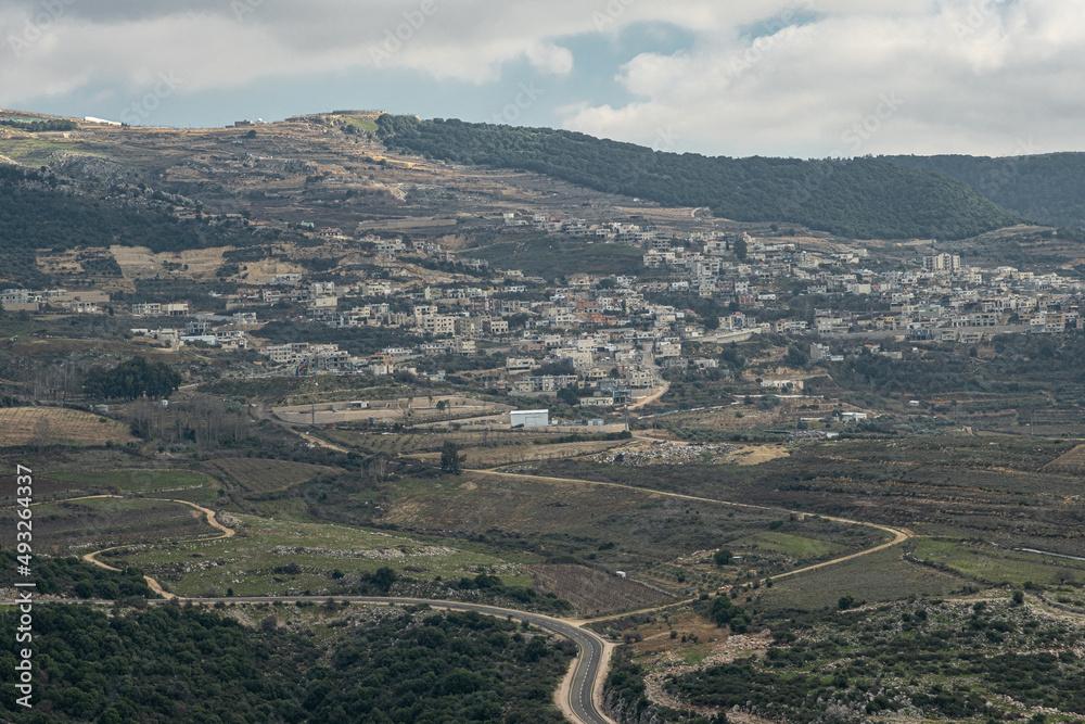 View of Ein-Qiniyye, a Druze village located on the southern foothills of Mount Hermon as seen from Nimrod Crusader Castle southern wall, Golan Heights, Israel.