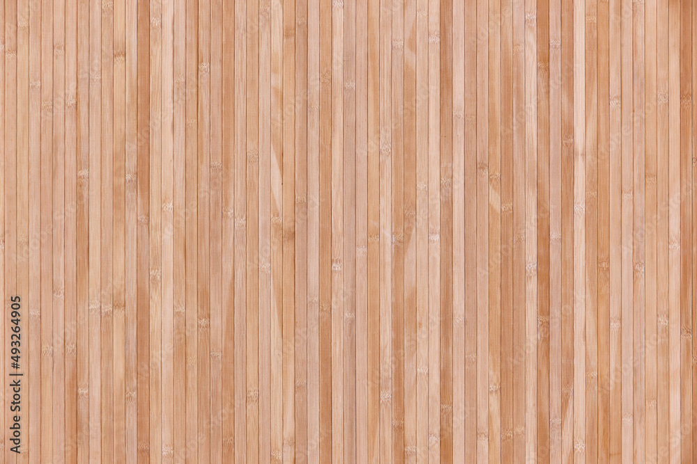 Naklejka premium Striped artificial wooden panel background. Textured decorative laminate surface