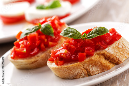 Italian appetizer bruschetta with fresh tomatoes on a plate