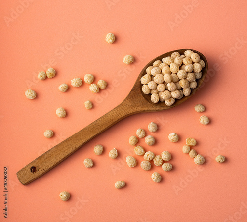 Quinoa seeds pop in the wooden spoon - Chenopodium quinoa photo